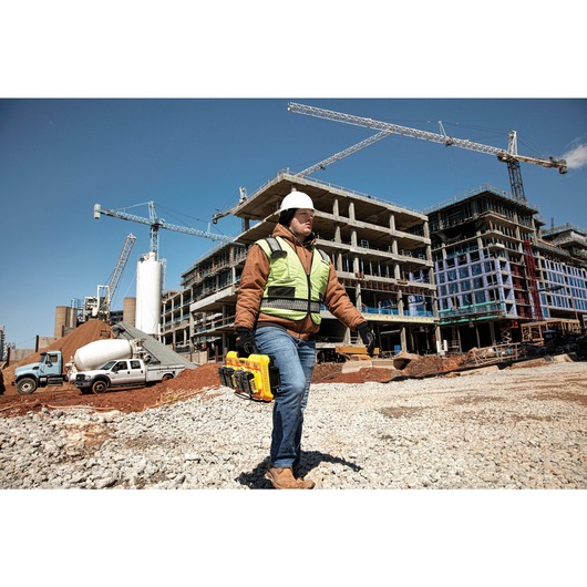 Multiport fast charger being carried by a construction worker