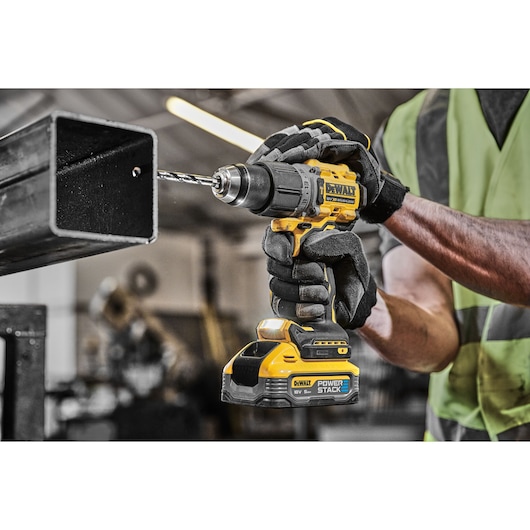 18V XR Brushless Hammer Drill Driver 3/4 right view with LED light drilling metal