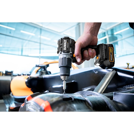 Limited Editon DEWALT/McLaren Drill Driver being used in McLaren garage on car chassis
