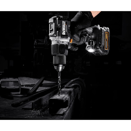 Limited Edition DEWALT/McLaren Drill Driver being used in the fabrication of steel framework/crossmember close-up of LED light
