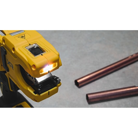 DEWALT 18V XR Brushless Copper Tubing Cutter close up image showing LED light