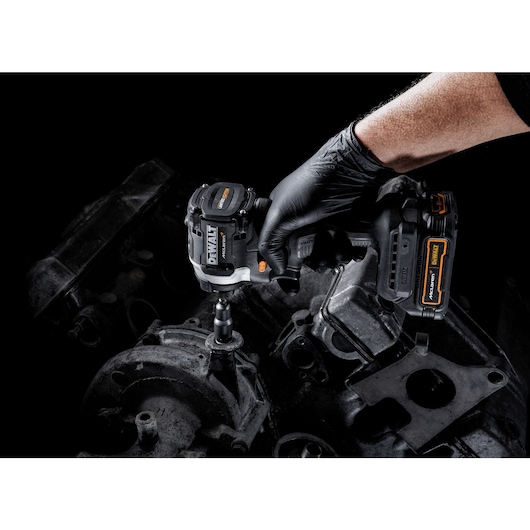 Limited Edition DEWALT/McLaren Impact Driver being used to remove engine mounting close-up shot