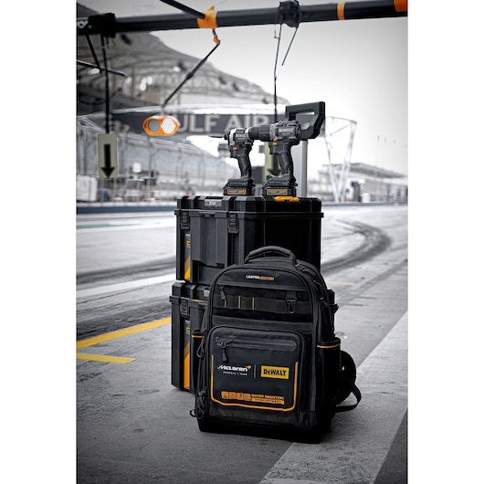 DWST60452-1 Limited Edition DEWALT/McLaren TSTAK 3-IN-1 Rolling Workshop Bundle, with DCD85ME2GT Drill Driver, DCF85ME2GT Impact Driver and  DWST60122-1 Jobsite Backpack in pitlane garage