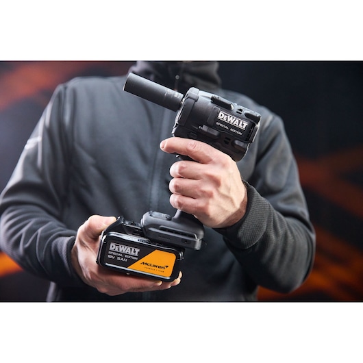 5Ah battery being connected to the DEWALT x McLaren F1 Team 18V XR Special Edition Compact Impact Wrench