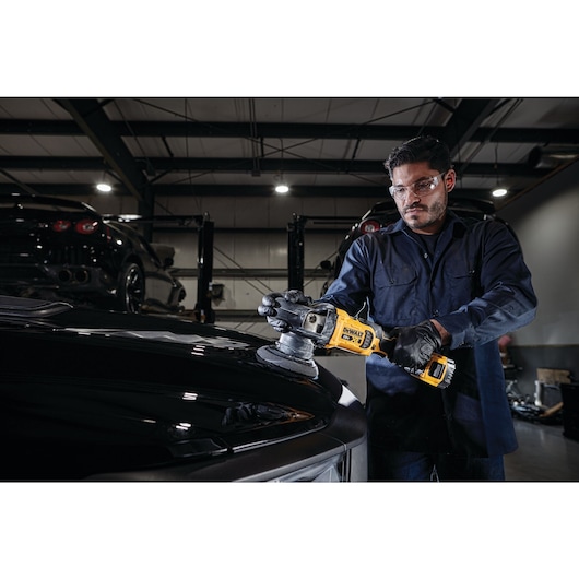 XR cordless variable speed random orbit polisher being used by a person to polish a car