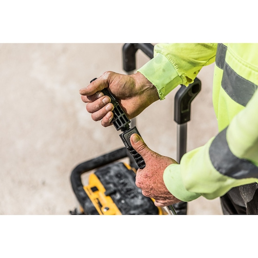 Close up view of a nozzle being connected to the Dewalt 2 x 18V Cordless Pressure Washer