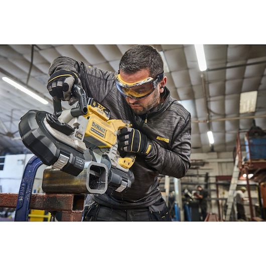 DEWALT 18V XR Brushless Deep Cut Band Saw cutting steel box