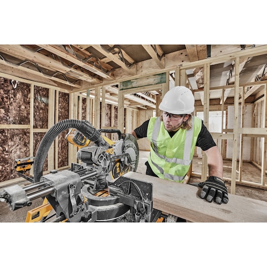 54v XR FLEXVOLT 305mm Mitre Saw 3/4 left side view on work site 54v XR FLEXVOLT 305mm Mitre Saw 3/4 left side view on work site