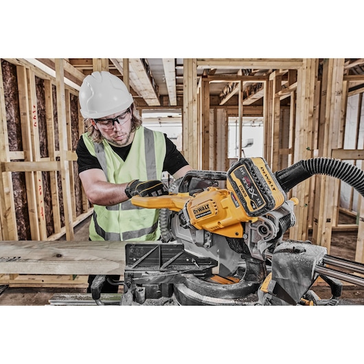 54v XR FLEXVOLT 305mm Mitre Saw 3/4 right side view used on work site 54v XR FLEXVOLT 305mm Mitre Saw 3/4 right side view used on work site