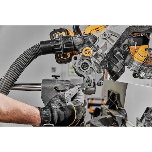 54v XR FLEXVOLT 305mm Mitre Saw close up of head lock and dust extraction 54v XR FLEXVOLT 305mm Mitre Saw close up of head lock and dust extraction