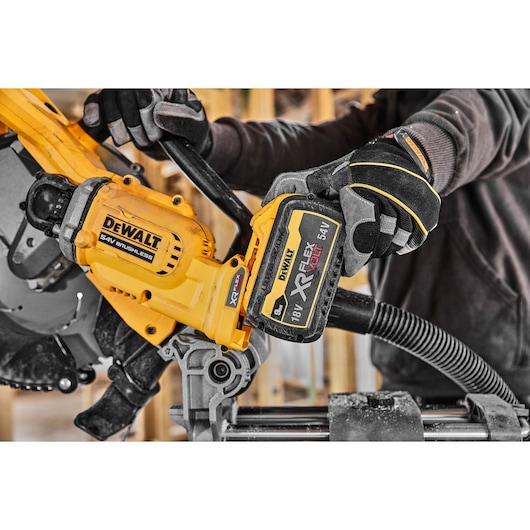 54v XR FLEXVOLT 305mm Mitre Saw close up of slide battery 54v XR FLEXVOLT 305mm Mitre Saw close up of slide battery