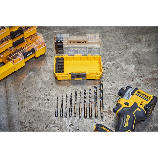 overhead shot of DEWALT 40 Piece Impact Screwdriver Bit Set with lid open, 10 drill bits out of the box, and a DEWALT drill