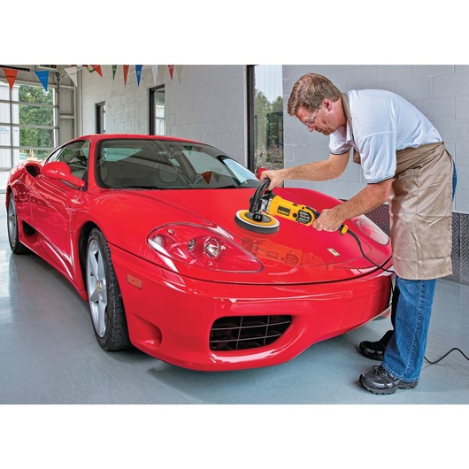 Variable speed polisher with soft start being used to polish car.