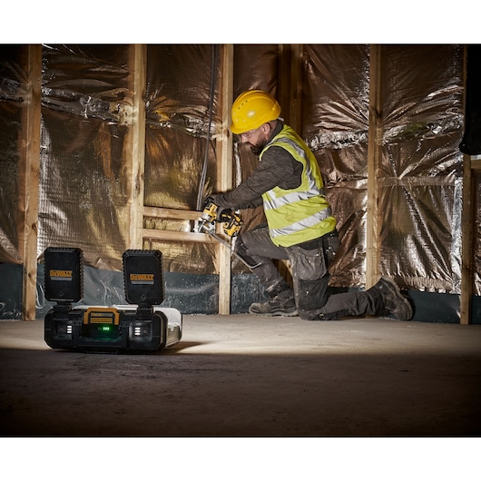 TOUGHSYSTEM 2.0 Cordless Adjustable Work Light  being used on floor on job site, close up of illumination modes