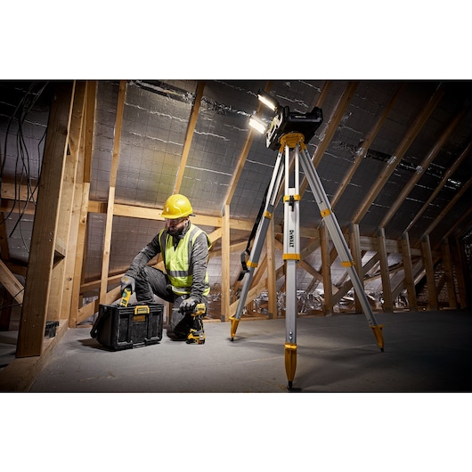 TOUGHSYSTEM 2.0 Cordless Adjustable Work Light tripod mounted on job site