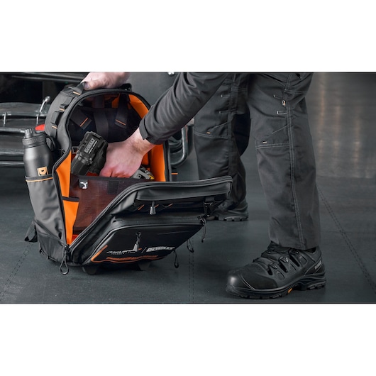 DEWALT backpack with compartments for tools and drink bottle, used for organized tool storage and transport.