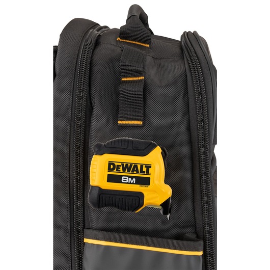 Tape hooked on to the side of a Dewalt Pro Backpack  Tape hooked on to the side of a Dewalt Pro Backpack