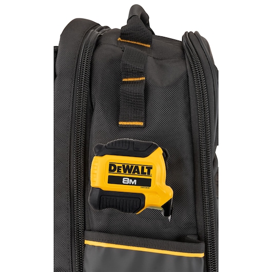 Tape hooked on to the side of a Dewalt Pro Backpack 