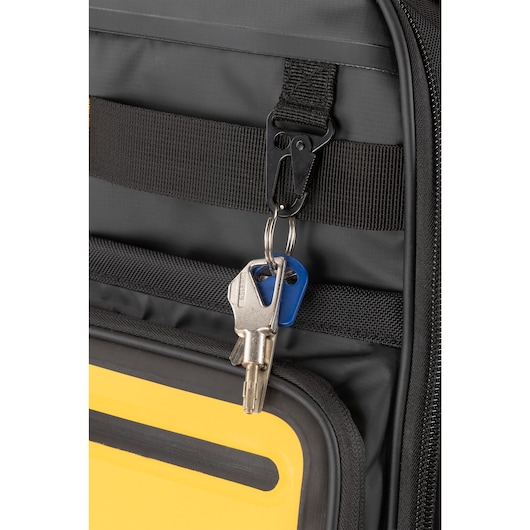 Wallet being placed into external pcoket of the Dewalt Pro Backpack