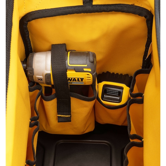 Inside pocket of Dewalt 20 inch Pro Open Mouth Tool Bag hold a Dewalt drill and tape measure