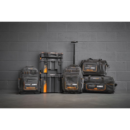 A group shot of the DEWALT/McLaren 2025 storage range featuring a backpack with handle and wheels (DWST60101-9), tool bag (DWST60104-9), backpack (DWST60122-1), TSTAK 3-in-1 workshop bundle (DWST60452-1) and duffle bag (DWST83522-9).