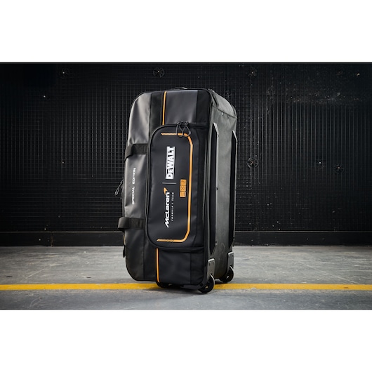 DEWALT McLaren special edition black wheeled tool bag for professional storage and transport.