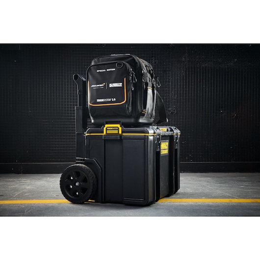 DEWALT Toughsystem 2.0 wheeled toolbox with McLaren edition backpack for tool storage and transport.
